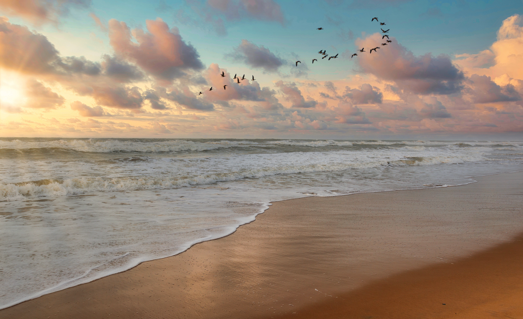 Sea beach at sunrise with moody sky at Puri, Odisha, India